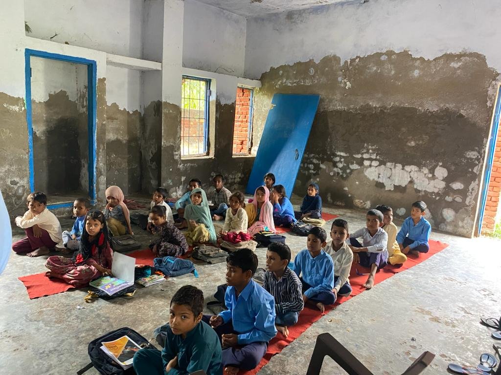 PRF volunteers and children during a learning session